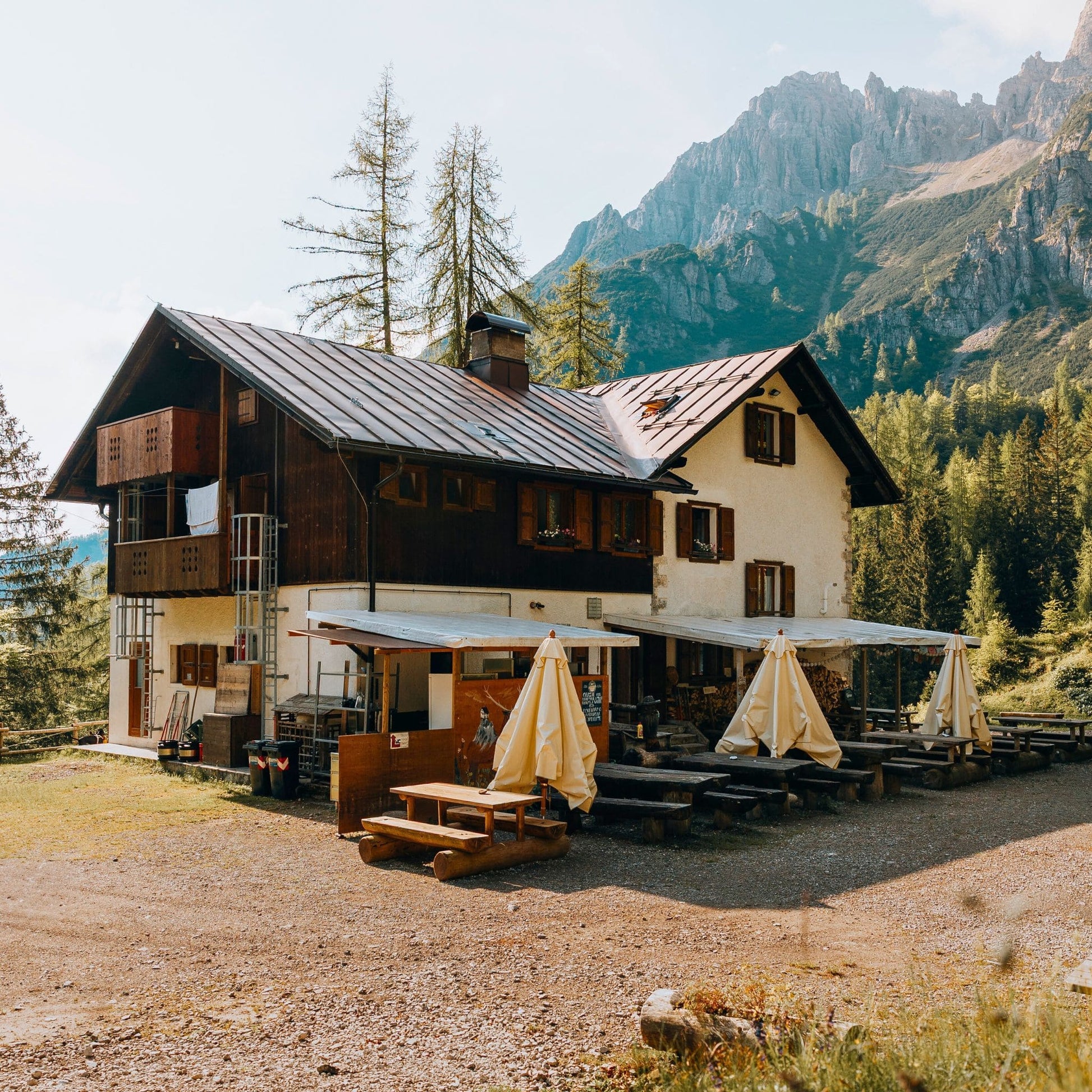 Traditional alpine rifugio Giaf with wooden terrace and mountain views in Friulian Dolomites Natural Park