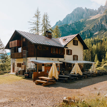 Traditional alpine rifugio Giaf with wooden terrace and mountain views in Friulian Dolomites Natural Park